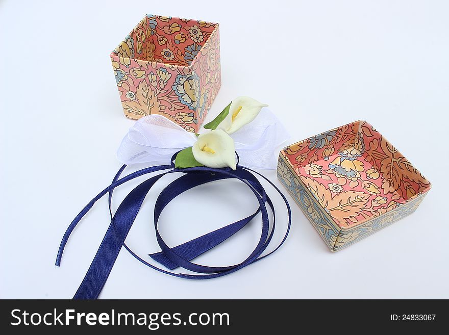 Nice image of opened gift box with decorative flowers and bow. Nice image of opened gift box with decorative flowers and bow