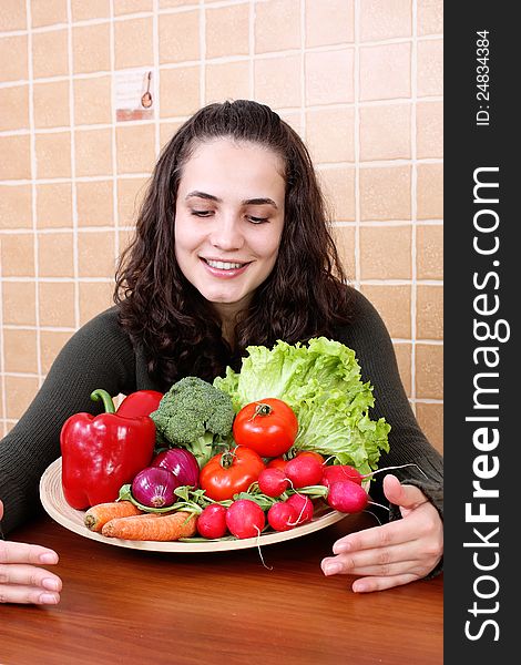 Young Woman Eating Vegetable Salad