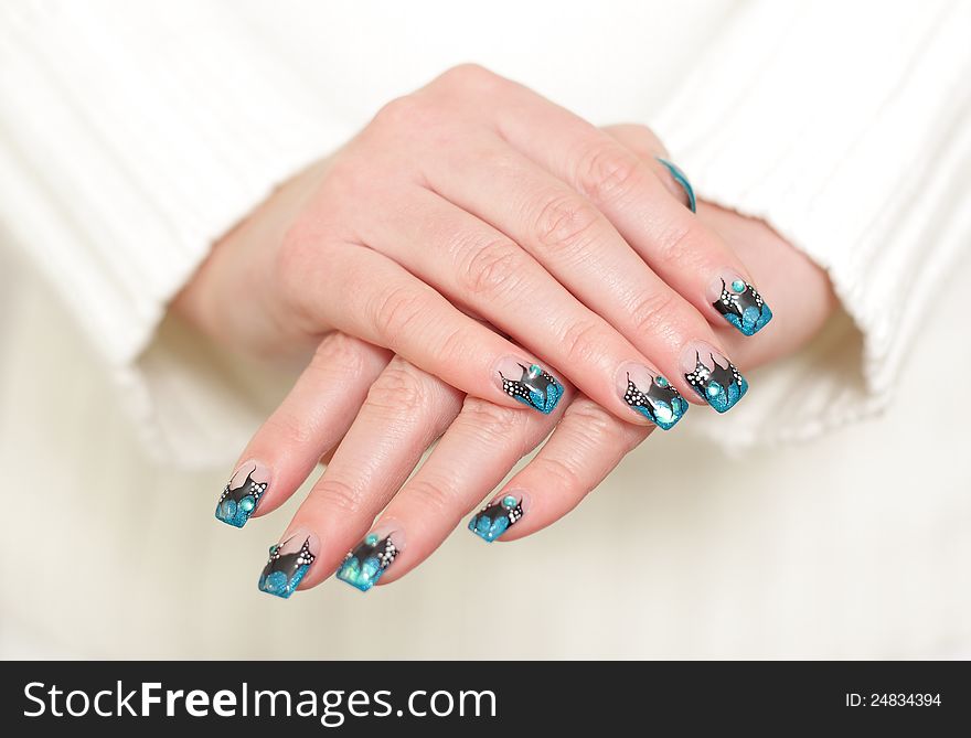 Female hands with blue manicure