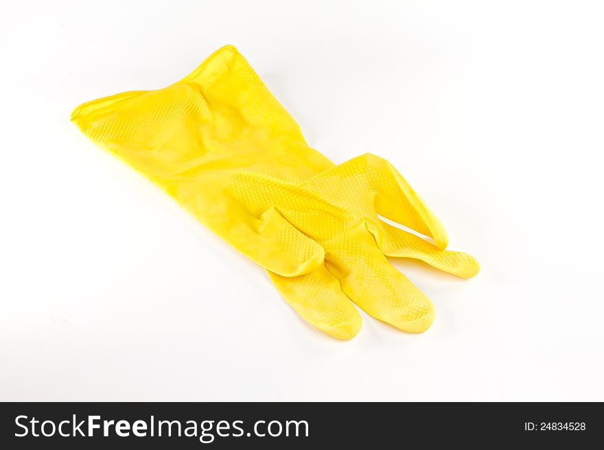 Yellow plastic glove on white background. Yellow plastic glove on white background