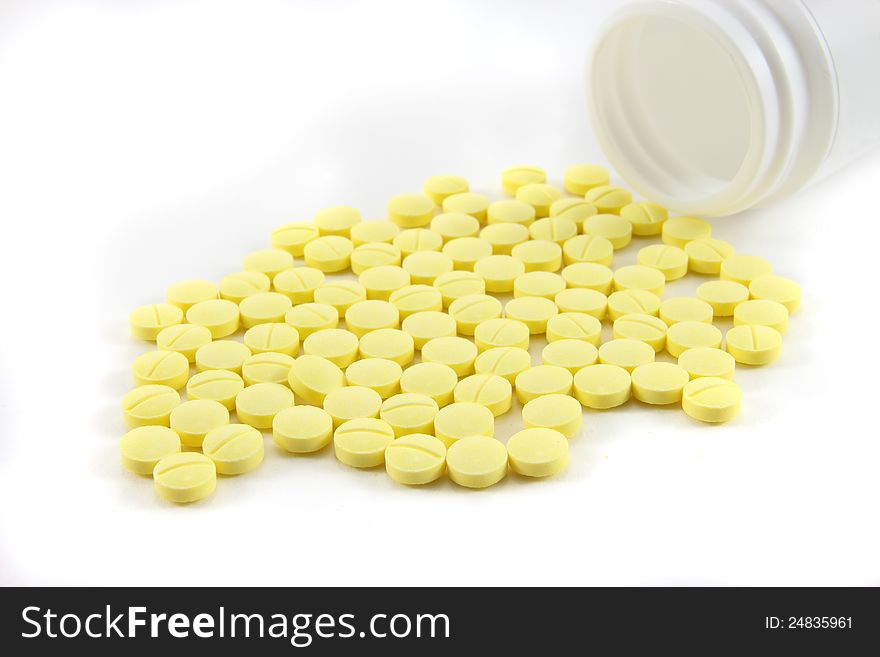 Medicine pills with and bottle on white background