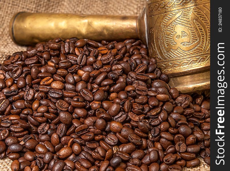 Arabic old copper turks and scattered coffee grains. Arabic old copper turks and scattered coffee grains