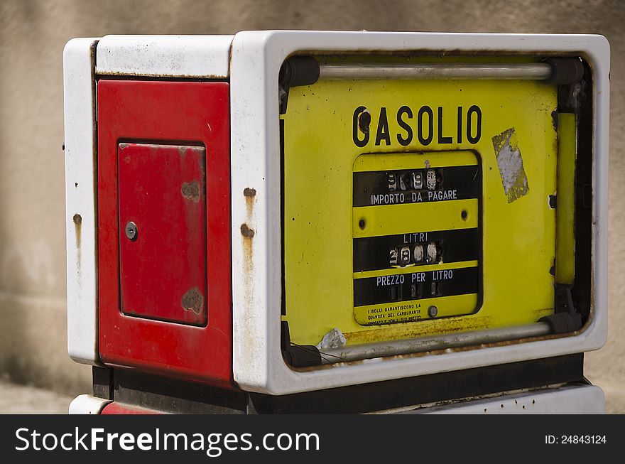 Old vintage gas pump in mining town in the west coast of Sardinia. Old vintage gas pump in mining town in the west coast of Sardinia.