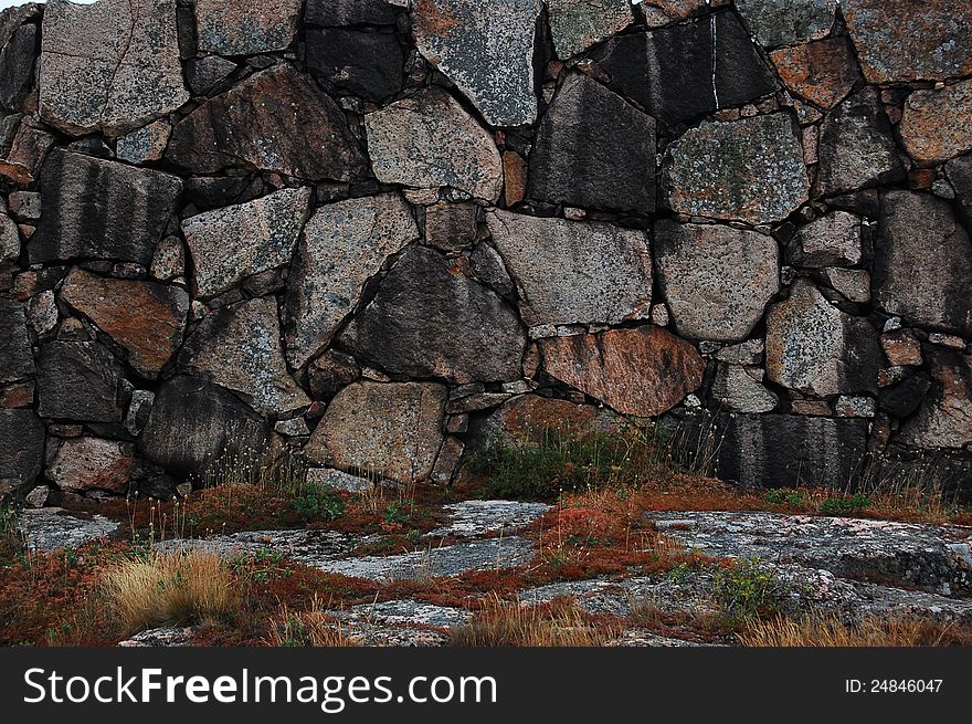 Granite boulders with patches of grass.