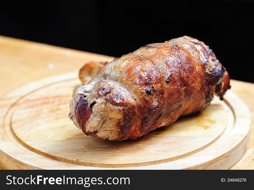 Rabbit stuffed with plums and roasted in butter and then in the oven on a wooden. Rabbit stuffed with plums and roasted in butter and then in the oven on a wooden