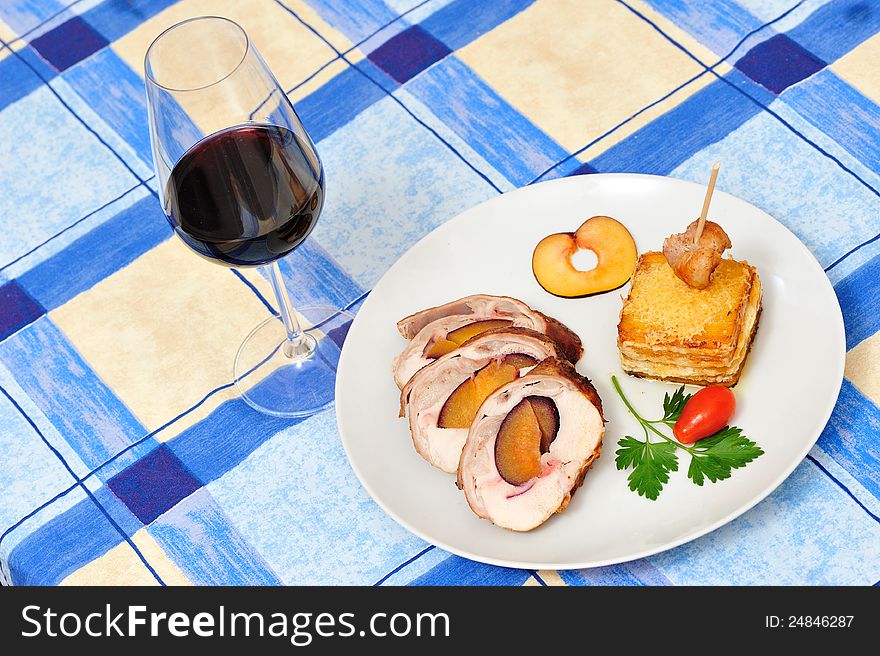 Stuffed rabbit filled with plums, fried in butter and then roasted in the oven with potatoes and cheese garnish. Stuffed rabbit filled with plums, fried in butter and then roasted in the oven with potatoes and cheese garnish