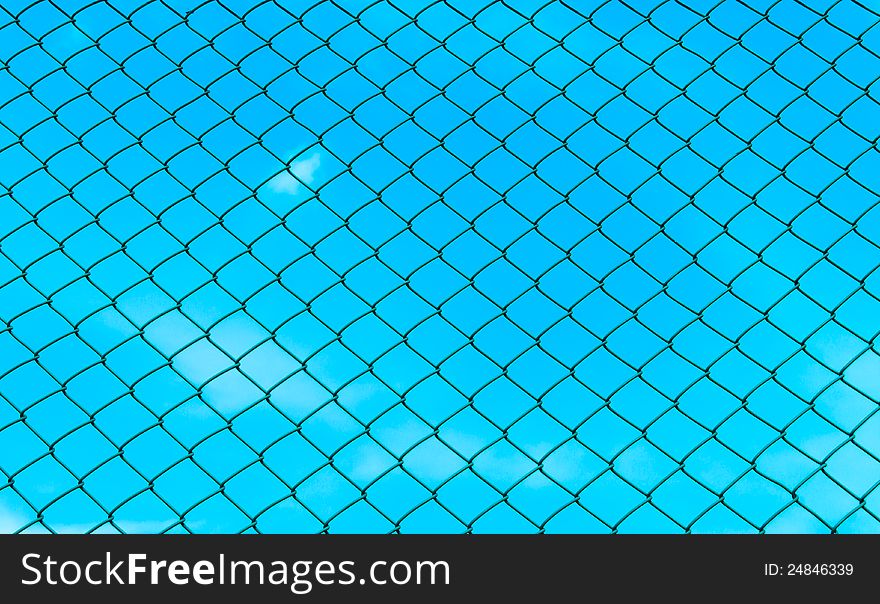 Chain fence with blue sky on the back