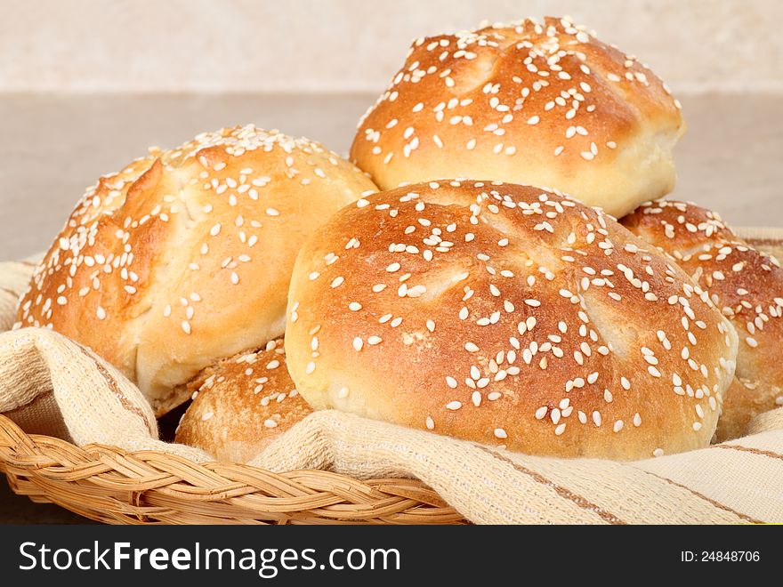 Closeup of kaiser rolls in a basket. Closeup of kaiser rolls in a basket