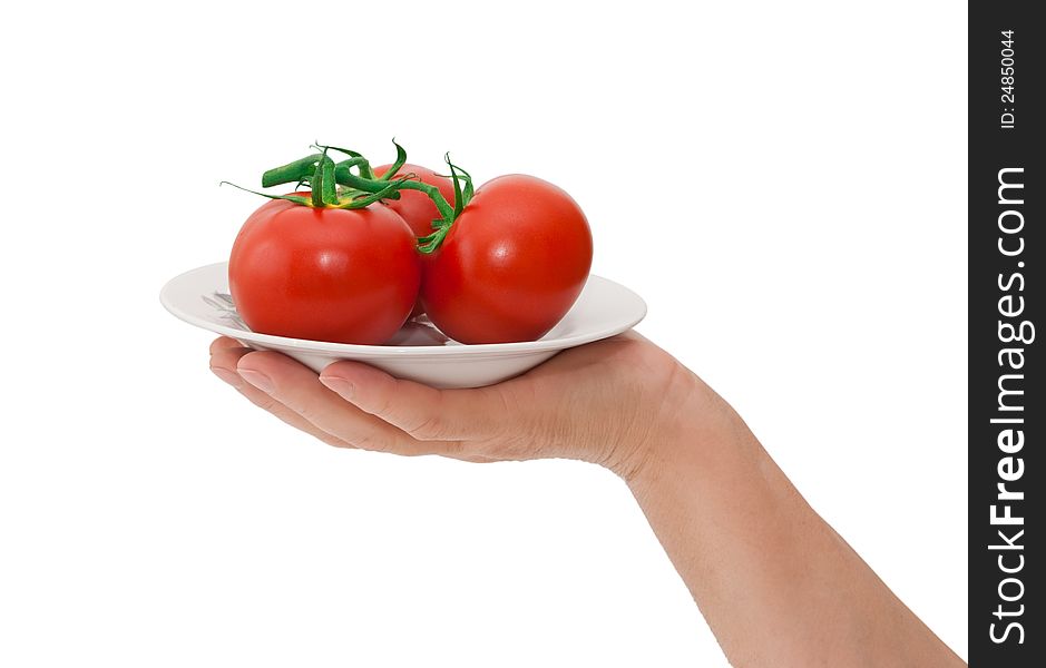 Plate with tomatoes isolated on white