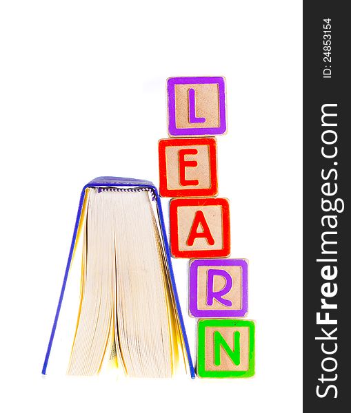 Learn Spelled Out Leaning on Open Book