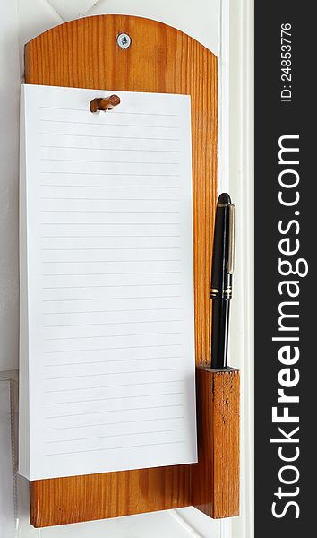 A telephone note pad complete with pen