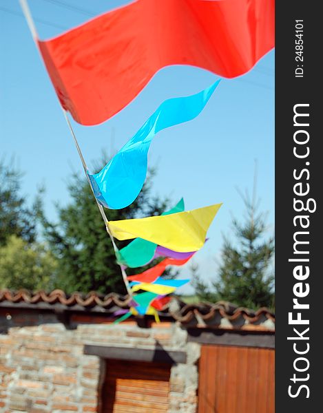 Party flags of various color in the wind