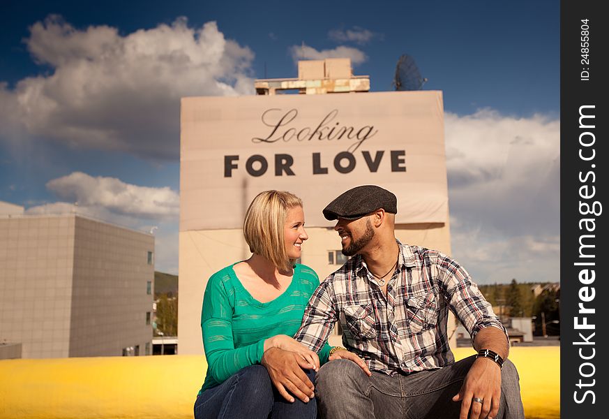 Engaged Couple With Love Sign