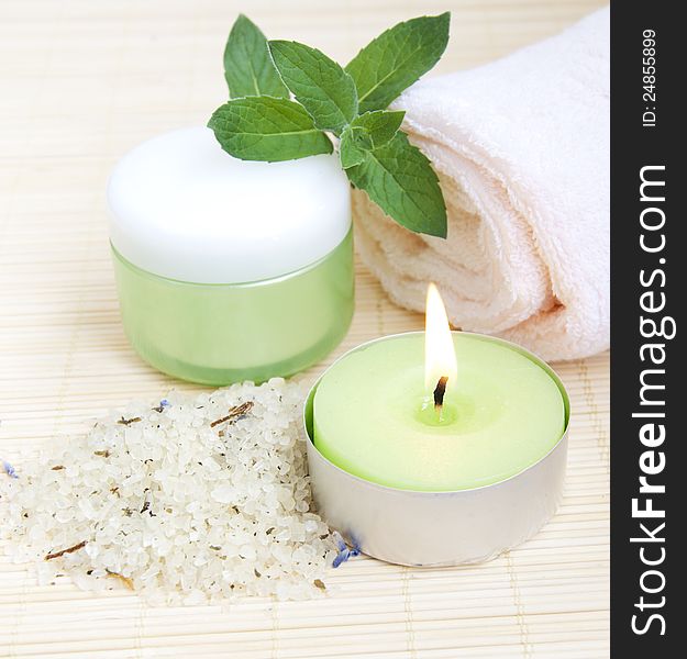 Cosmetic moisturizing cream with mint, herbal sea salt  and towel. Cosmetic moisturizing cream with mint, herbal sea salt  and towel