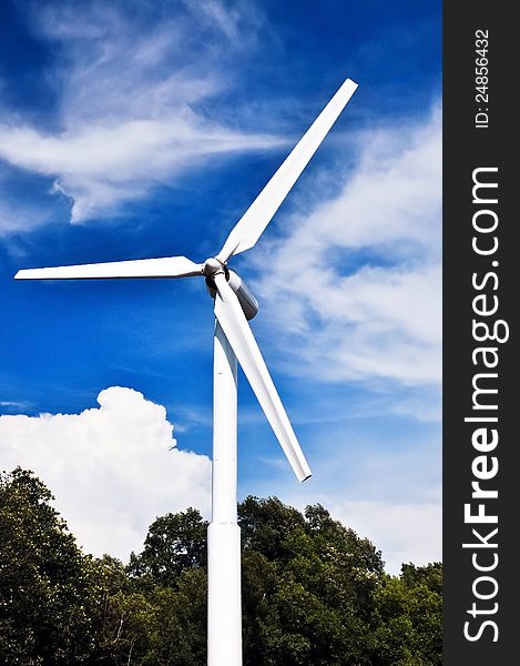 A wind turbine at seaside with blue sky,clean energy. A wind turbine at seaside with blue sky,clean energy