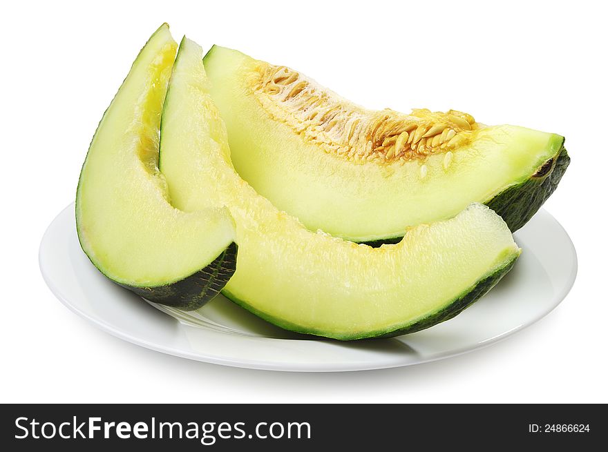 Melon slices on a plate on white