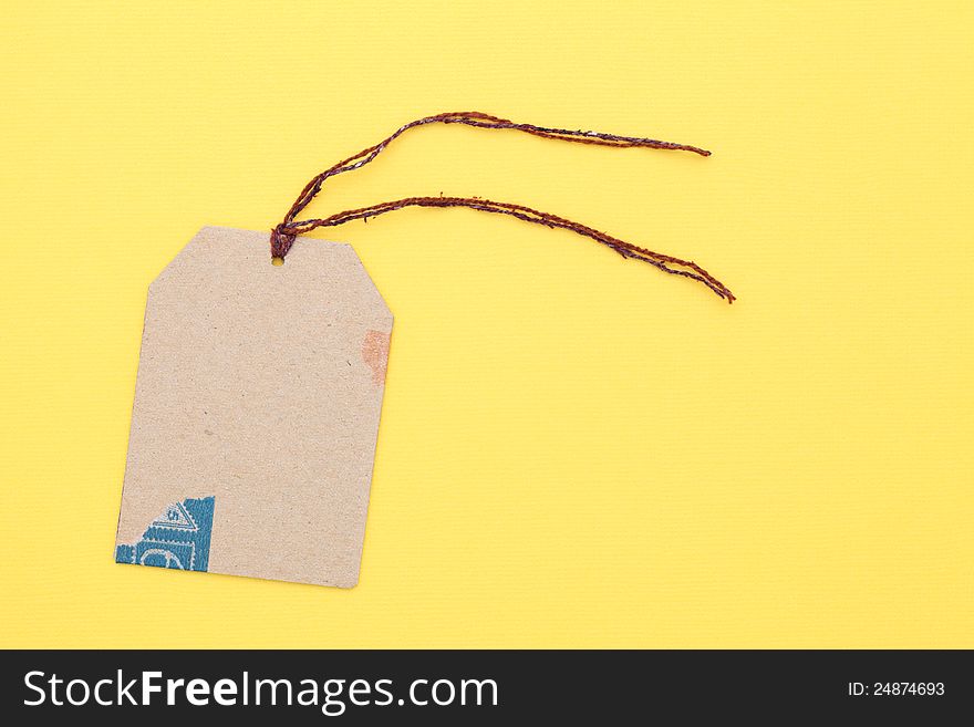 Blank tag on yellow paper background