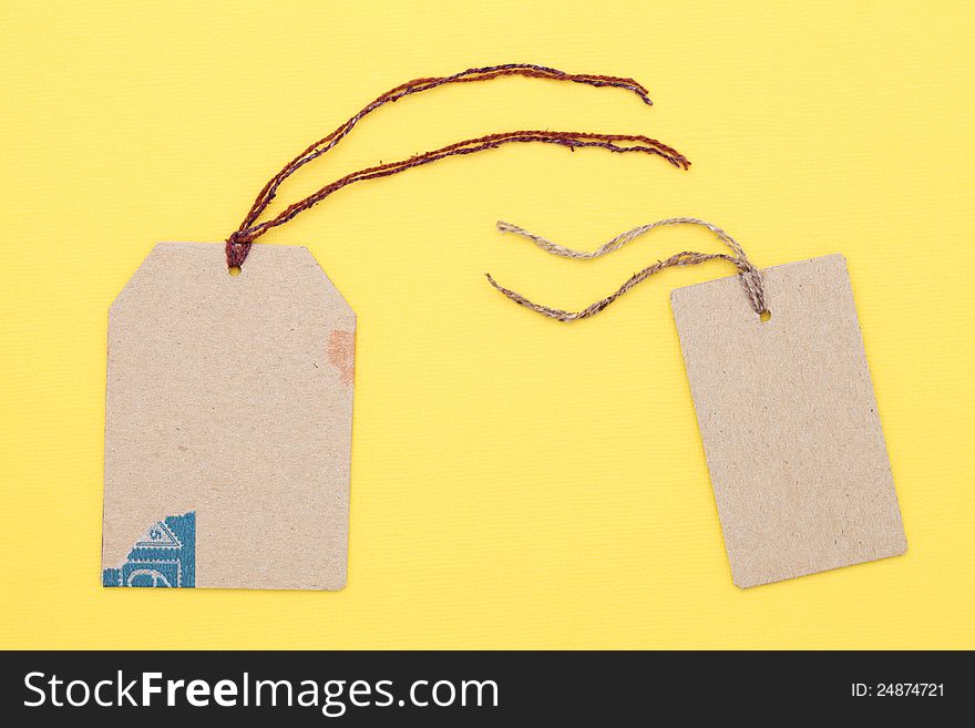 Blank tag on yellow paper background