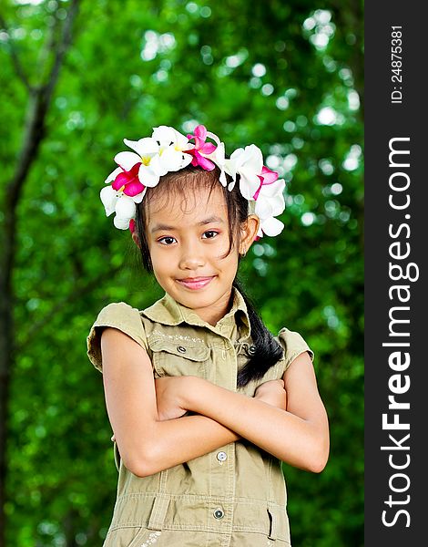 Cute girl standing with hands folded arms. Cute girl standing with hands folded arms