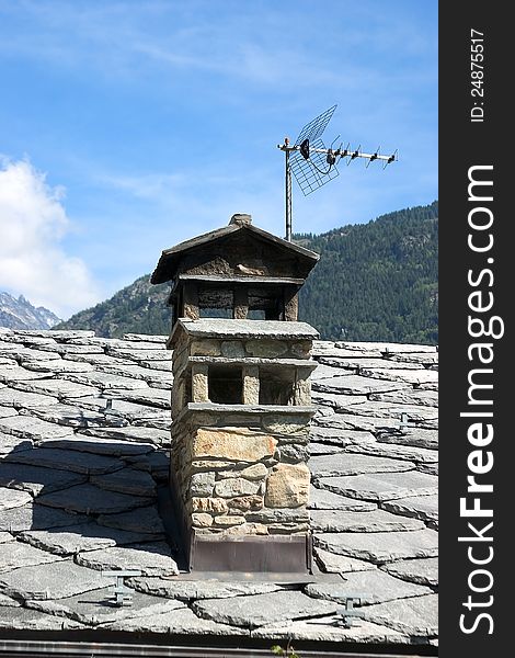 Shingle roof and chimney with antenna