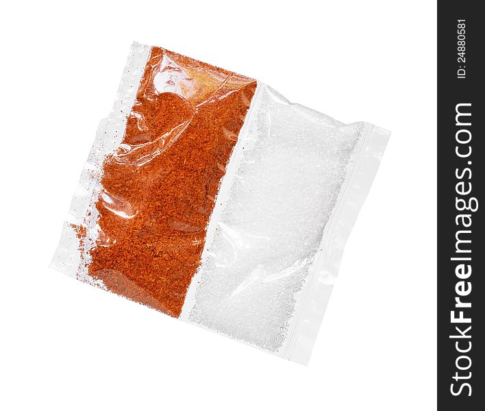 Chili powder and sugar in transparent bag isolated on white background. Chili powder and sugar in transparent bag isolated on white background