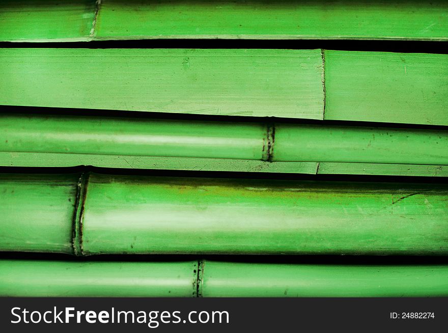 Stack of green bamboo trunks