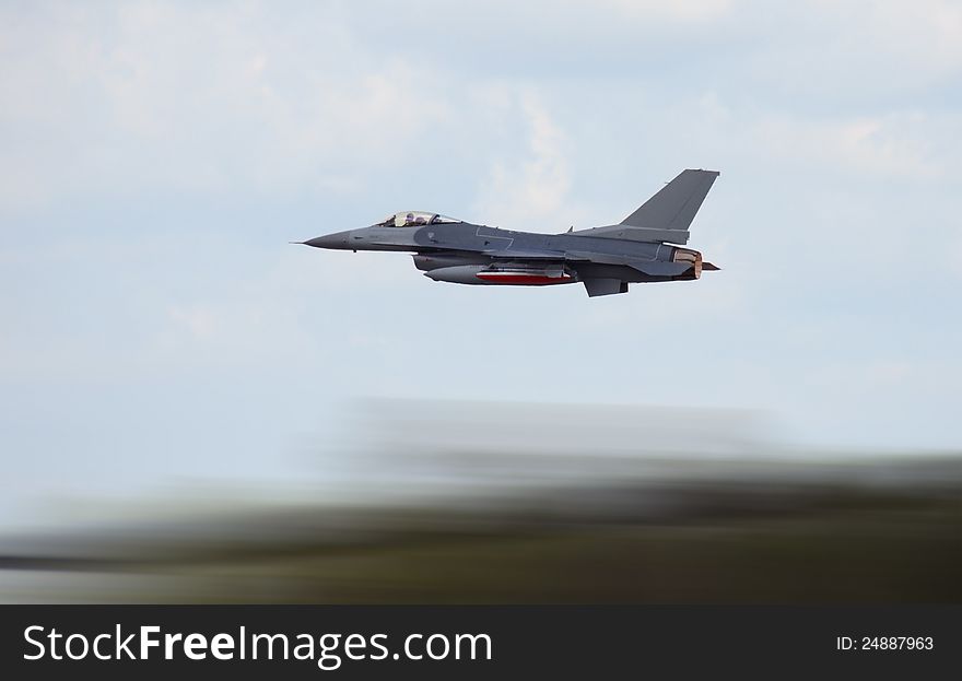 Military jet airplane at high speed with motion blur. Military jet airplane at high speed with motion blur