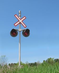 Railroad Crossing Signal And Blue Sky Stock Photo