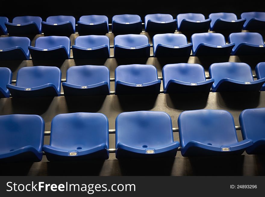 Rows pf empty blue seats in the stadium