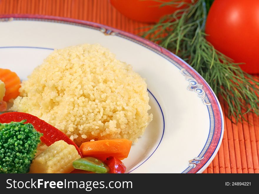 Couscous with vegetables on a plate