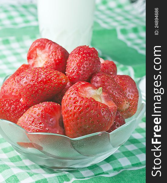 Strawberries in a glass bowl on table