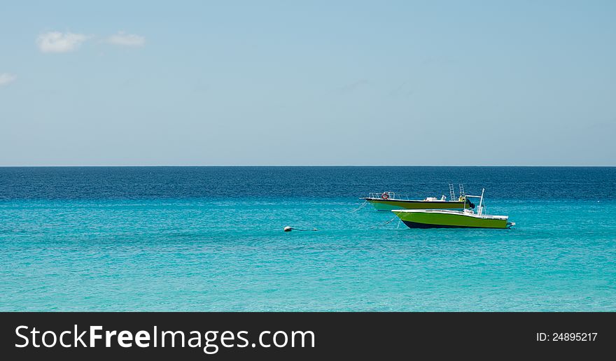 Two yellow boat in the caribbean ocean. Two yellow boat in the caribbean ocean