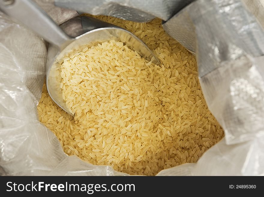 Close up shot of rice in a sack. Close up shot of rice in a sack