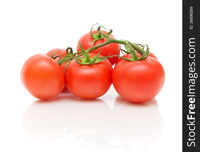 Bunch of ripe tomatoes isolated on white close-up. Bunch of ripe tomatoes isolated on white close-up