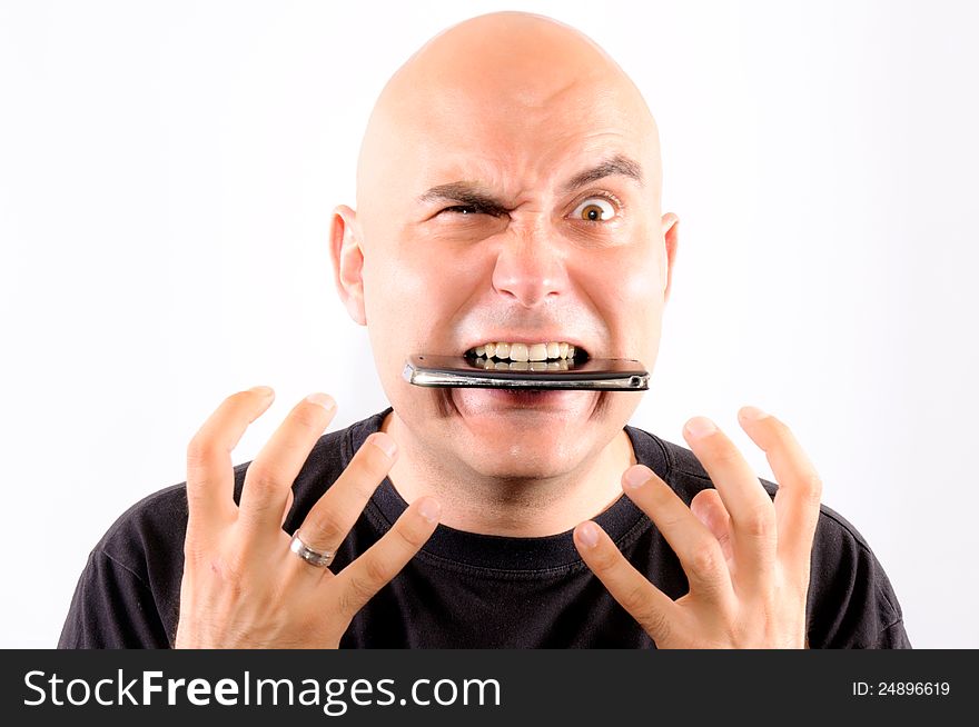 Bald guy eating mobile phone