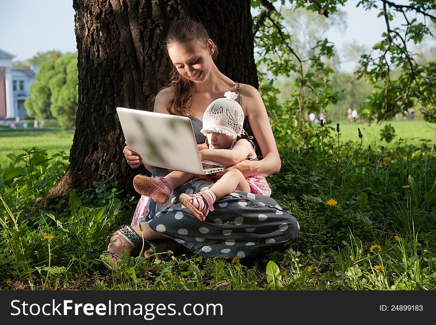 Woman With Child And Laptop