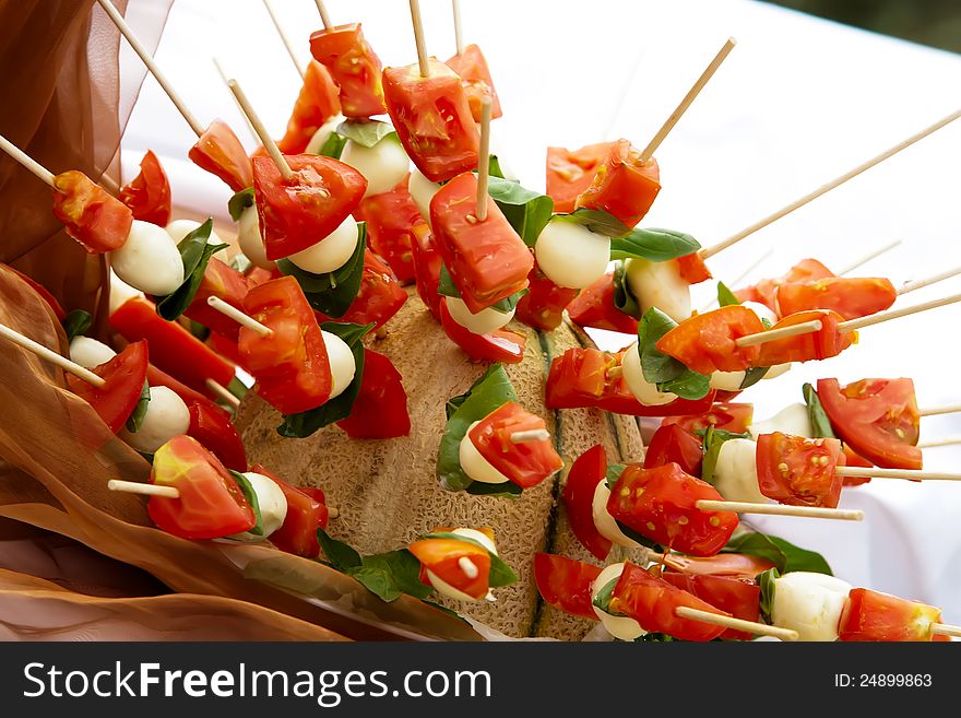 Tomatoes with cheese on a stick. Tomatoes with cheese on a stick.