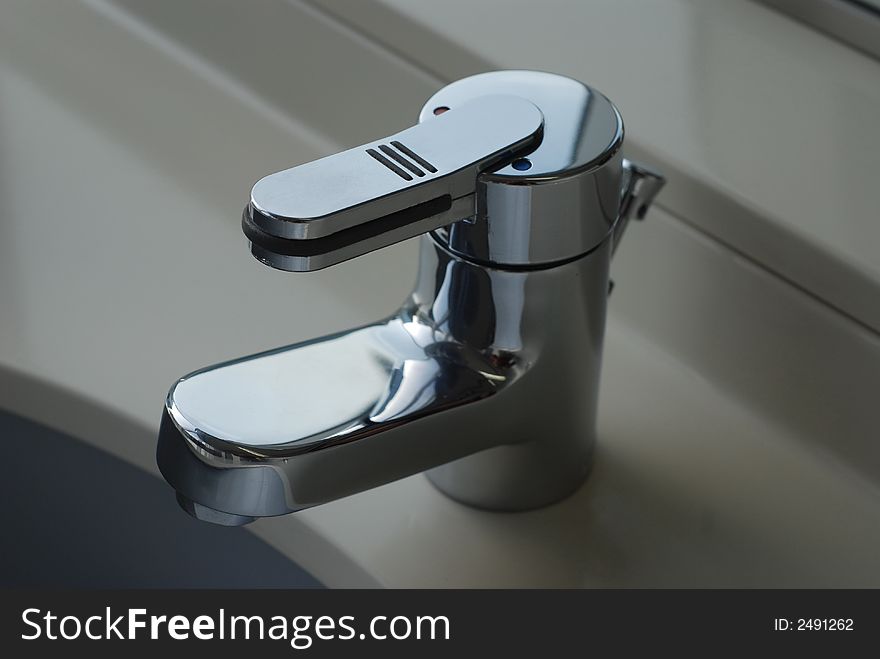 Photo of a chrome metal sink.