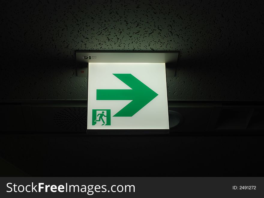 Emergency exit sign on a dark background