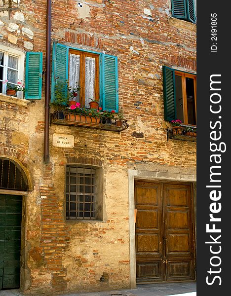 Windows with shutters, village in Tuscany region of Italy. Windows with shutters, village in Tuscany region of Italy.