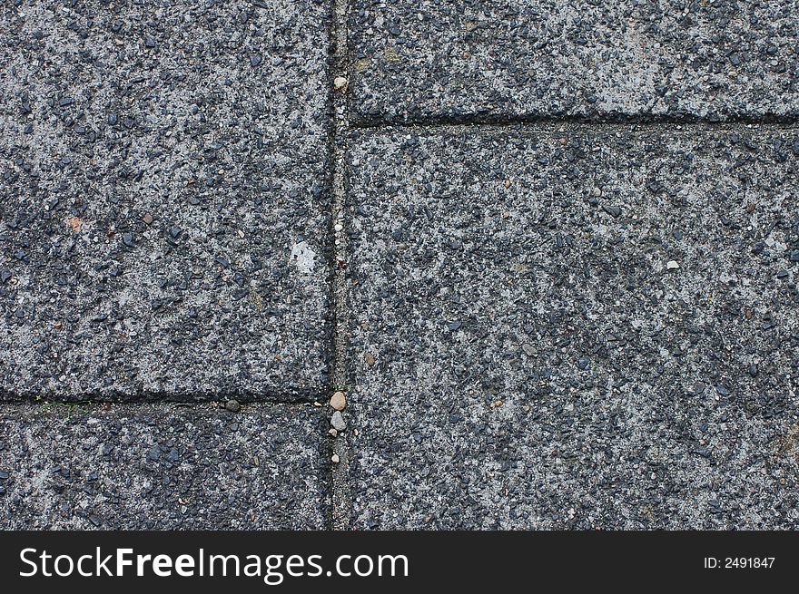 Street stones texture of a sidewalk