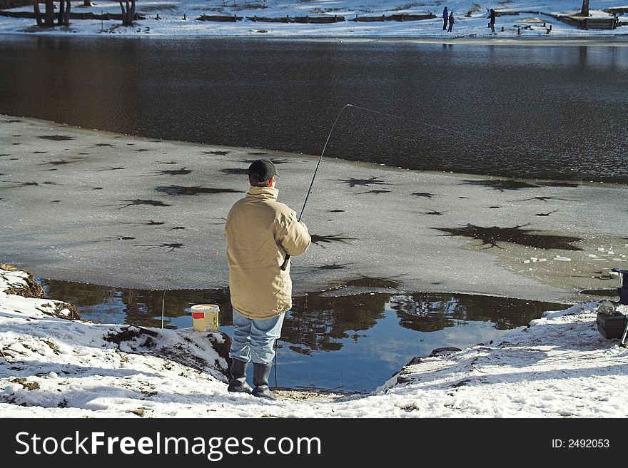 Little fischerman fishing in winter. Little fischerman fishing in winter