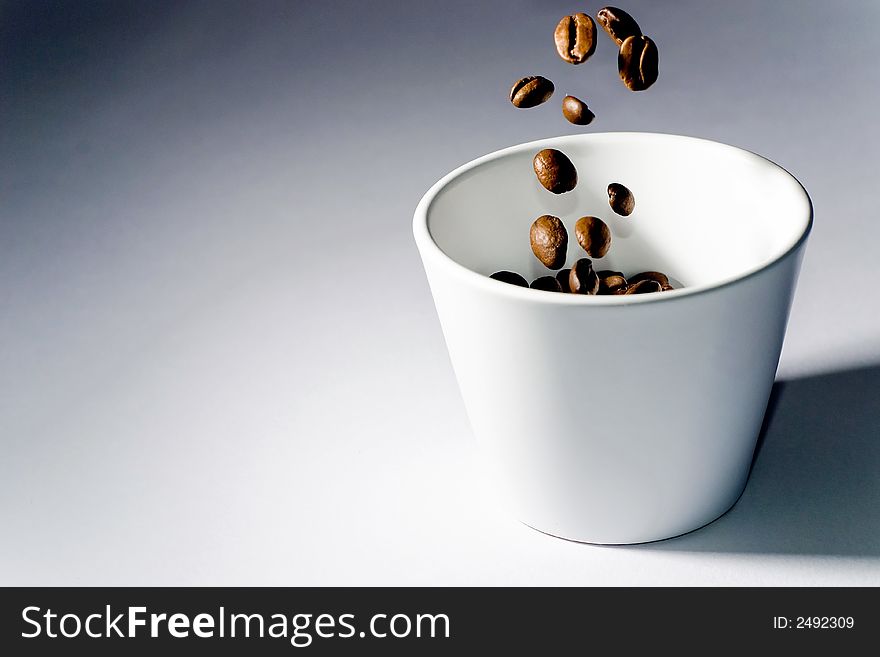 Picture of coffee beans in motion. Picture of coffee beans in motion