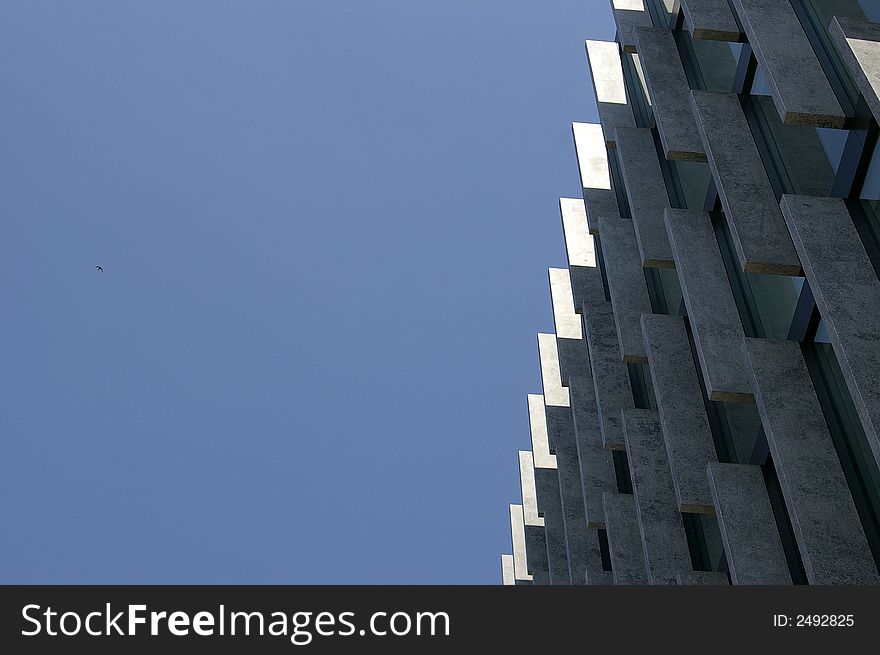 Detail of office building stone facade in the center of Warsaw, Poland