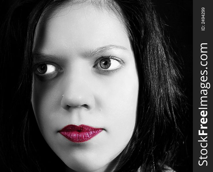 Black&white portrait of young woman with red lips