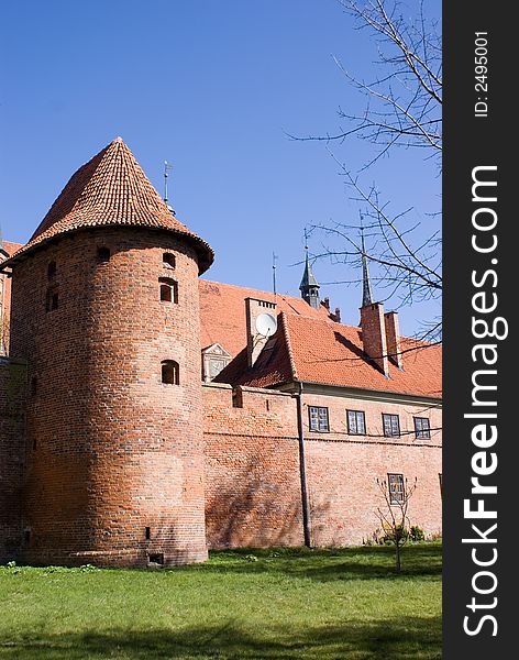 Tower with a fortification, the dark blue sky. Tower with a fortification, the dark blue sky