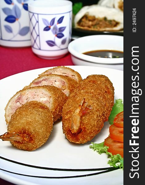 Plate of fried pork and shrimp meat roll