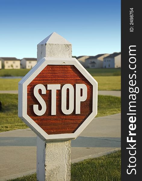 Here is a wooden stop sign in a subdivision. Here is a wooden stop sign in a subdivision.