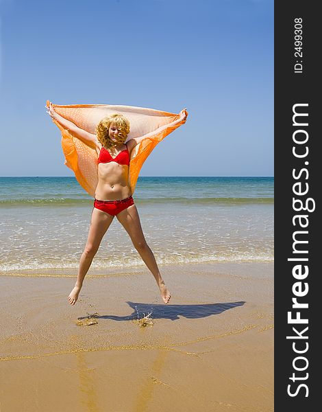 Girl runs and jumps on beach. Girl runs and jumps on beach