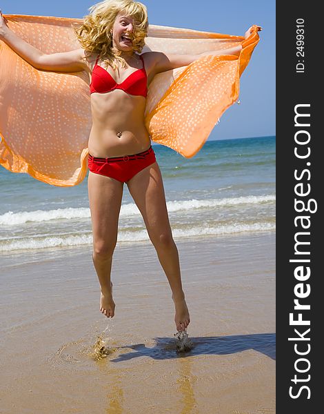 Girl Runs On Beach